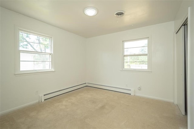 1222 S Maple St, Ottawa, KS 66067 - unfurnished bedroom with carpet floors, a baseboard radiator, and a closet