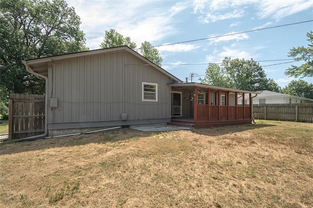 1222 S Maple St, Ottawa, KS 66067 - rear view of property featuring covered porch