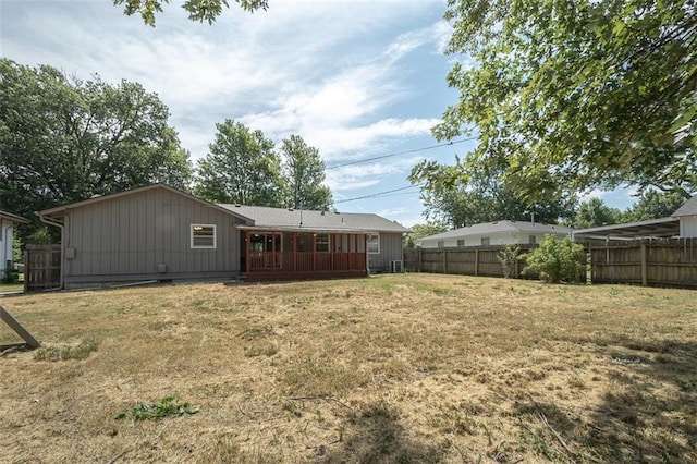 1222 S Maple St, Ottawa, KS 66067 - back of house featuring board and batten siding and a fenced backyard