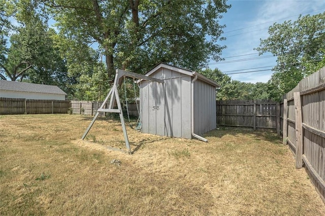 1222 S Maple St, Ottawa, KS 66067 - view of shed featuring a fenced backyard