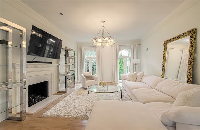 12600 Mohawk Ln, Leawood, KS 66209 - living room with crown molding, light wood-type flooring, a premium fireplace, and a chandelier