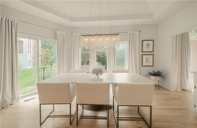 12600 Mohawk Ln, Leawood, KS 66209 - dining room with a raised ceiling and light wood-style floors