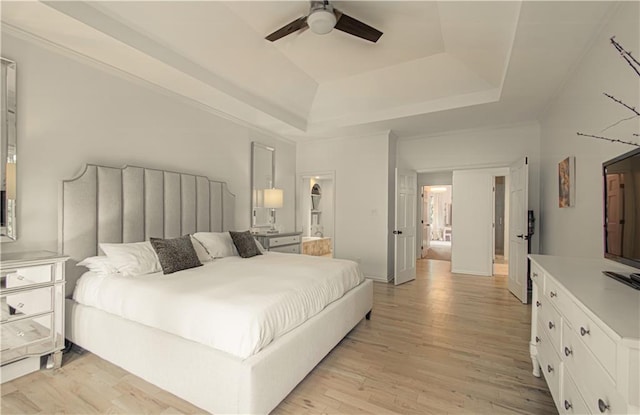 12600 Mohawk Ln, Leawood, KS 66209 - bedroom with a tray ceiling, light wood-style floors, and ceiling fan
