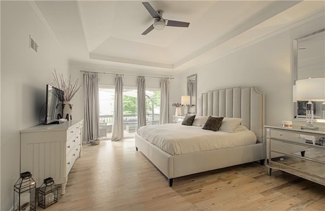 12600 Mohawk Ln, Leawood, KS 66209 - bedroom with a raised ceiling, access to outside, light wood-style floors, and a ceiling fan