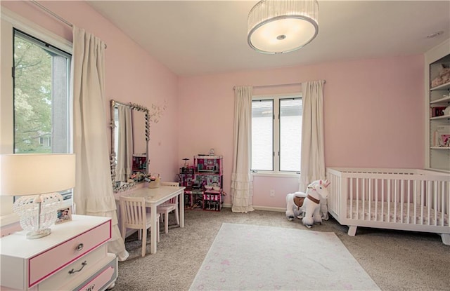 12600 Mohawk Ln, Leawood, KS 66209 - carpeted bedroom with a nursery area and baseboards