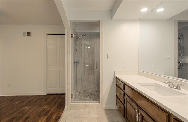 12600 Mohawk Ln, Leawood, KS 66209 - full bath featuring vanity, a stall shower, recessed lighting, and wood finished floors