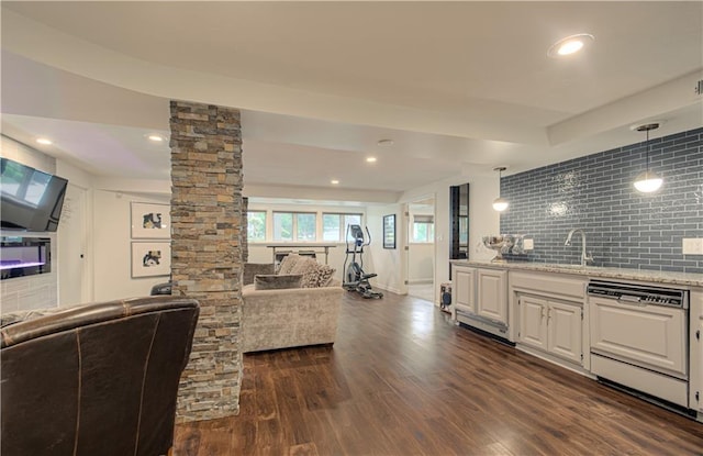 12600 Mohawk Ln, Leawood, KS 66209 - living area featuring dark wood-style flooring, ornate columns, and recessed lighting