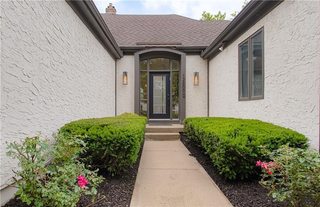 12600 Mohawk Ln, Leawood, KS 66209 - property entrance featuring stucco siding