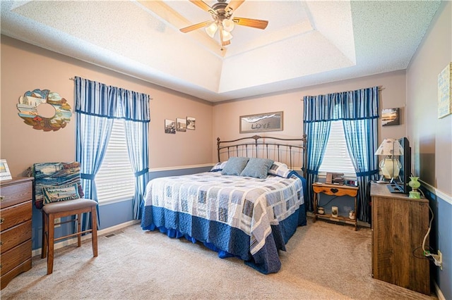 203 Scout St, Camden Point, MO 64018 - bedroom featuring multiple windows, a raised ceiling, carpet, and ceiling fan