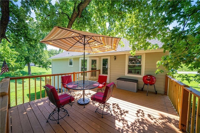 203 Scout St, Camden Point, MO 64018 - wooden terrace featuring outdoor dining space and a yard