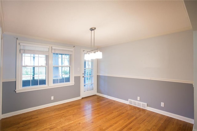 7236 Roe Ave, Prairie Village, KS 66208 - spare room featuring crown molding and light wood finished floors