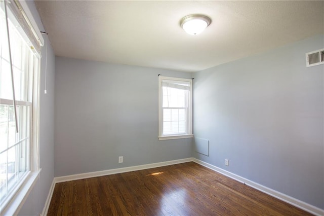 7236 Roe Ave, Prairie Village, KS 66208 - unfurnished room featuring dark wood-style floors and baseboards