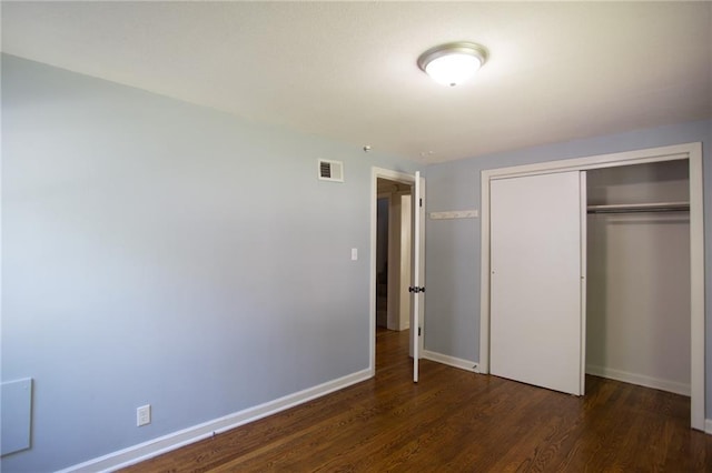 7236 Roe Ave, Prairie Village, KS 66208 - unfurnished bedroom with wood finished floors and a closet