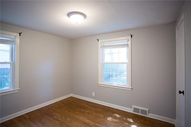 7236 Roe Ave, Prairie Village, KS 66208 - spare room with dark wood-type flooring and baseboards