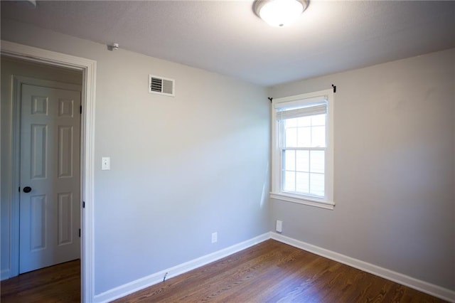7236 Roe Ave, Prairie Village, KS 66208 - unfurnished room featuring dark wood-style floors and baseboards