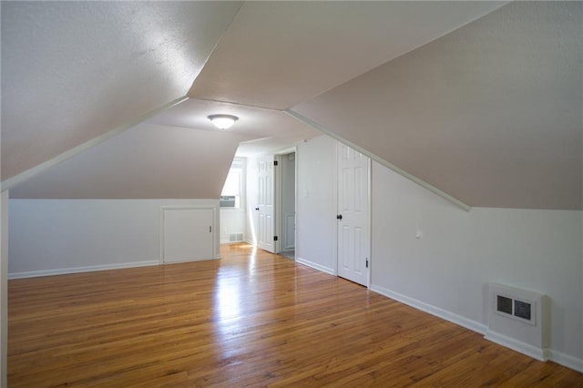 7236 Roe Ave, Prairie Village, KS 66208 - additional living space with wood finished floors and vaulted ceiling