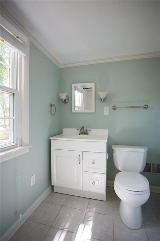 7236 Roe Ave, Prairie Village, KS 66208 - bathroom featuring vanity, plenty of natural light, ornamental molding, and tile patterned floors