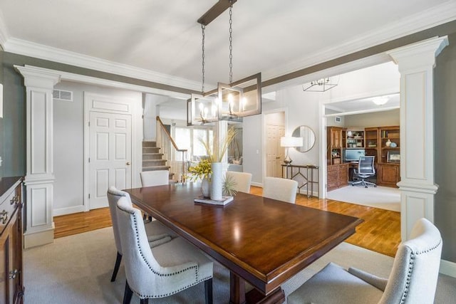 5125 W 164th St, Overland Park, KS 66085 - dining space with ornate columns, wood finished floors, ornamental molding, and a chandelier