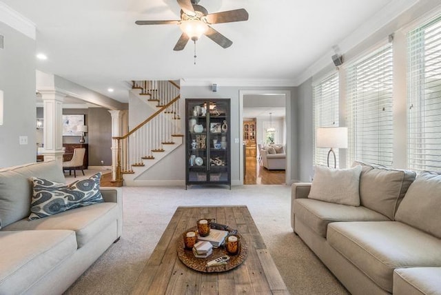 5125 W 164th St, Overland Park, KS 66085 - carpeted living area featuring stairs, ceiling fan, healthy amount of natural light, decorative columns, and crown molding