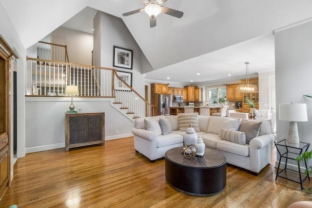 5125 W 164th St, Overland Park, KS 66085 - living room with stairs, ceiling fan, wood finished floors, high vaulted ceiling, and recessed lighting