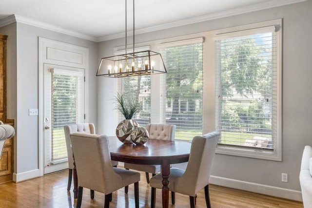 5125 W 164th St, Overland Park, KS 66085 - dining room with light wood-type flooring, a chandelier, and crown molding