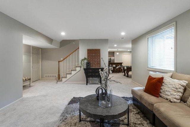5125 W 164th St, Overland Park, KS 66085 - living area featuring light carpet, stairway, and recessed lighting