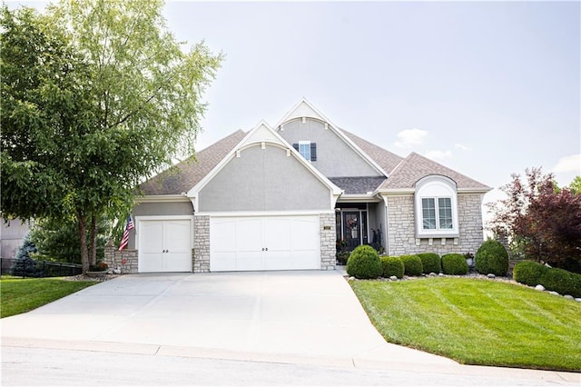 4500 Parks Summit Ter, Lees Summit, MO 64064 - view of front of property with stone siding, a garage, a front yard, stucco siding, and concrete driveway