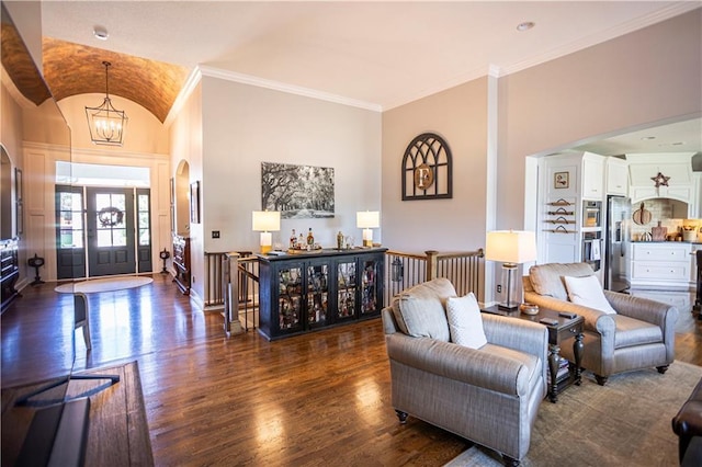4500 Parks Summit Ter, Lees Summit, MO 64064 - living area with arched walkways, wood finished floors, a chandelier, crown molding, and vaulted ceiling