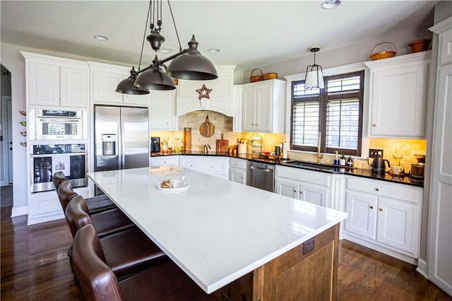 4500 Parks Summit Ter, Lees Summit, MO 64064 - kitchen with stainless steel appliances, dark wood-type flooring, white cabinets, and recessed lighting