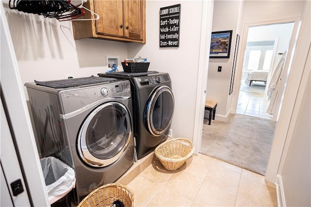 4500 Parks Summit Ter, Lees Summit, MO 64064 - laundry room featuring cabinet space, light colored carpet, washing machine and dryer, and light tile patterned floors