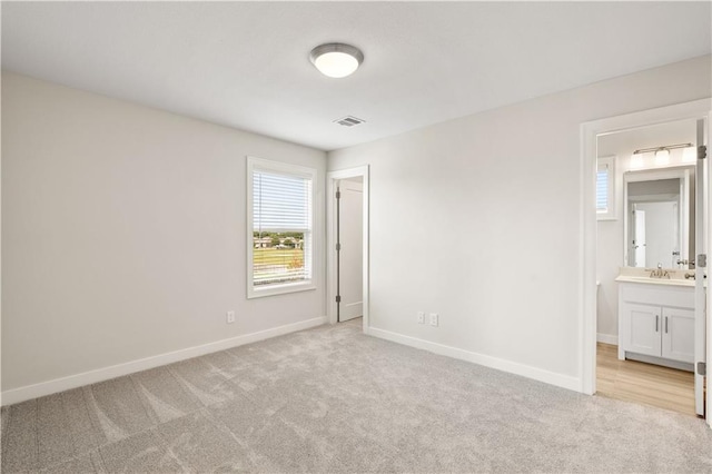 28400 W 161st Ter, Gardner, KS 66030 - unfurnished bedroom with light colored carpet and connected bathroom