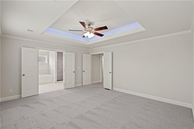 28501 W 161st Ter, Gardner, KS 66030 - unfurnished bedroom with crown molding, a raised ceiling, light carpet, connected bathroom, and a ceiling fan