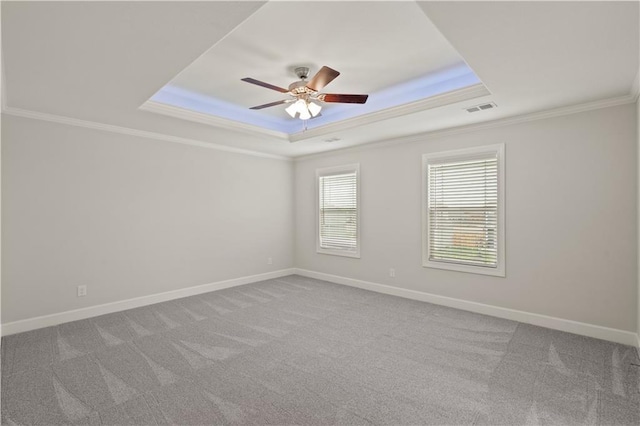 28501 W 161st Ter, Gardner, KS 66030 - carpeted empty room with a tray ceiling, crown molding, and a ceiling fan