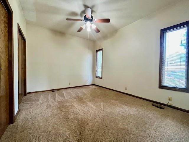 6960 Dancaster Rd, Topeka, KS 66610 - carpeted spare room with healthy amount of natural light and ceiling fan