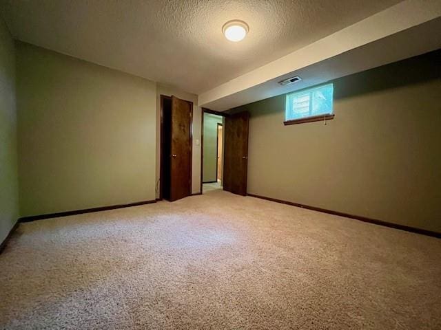 6960 Dancaster Rd, Topeka, KS 66610 - basement featuring light carpet and a textured ceiling