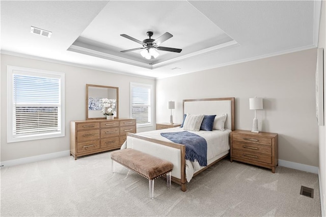 28225 W 162nd Ter, Gardner, KS 66030 - bedroom featuring a tray ceiling, light carpet, and a ceiling fan
