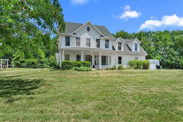 1148 N 1st Rd, Baldwin City, KS 66006 - view of front of property featuring a porch, a front yard, and a shingled roof