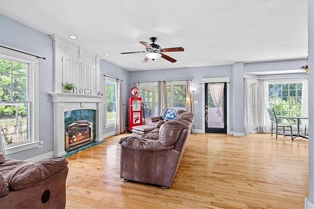 1148 N 1st Rd, Baldwin City, KS 66006 - living area featuring a fireplace, light wood-type flooring, ceiling fan, and recessed lighting
