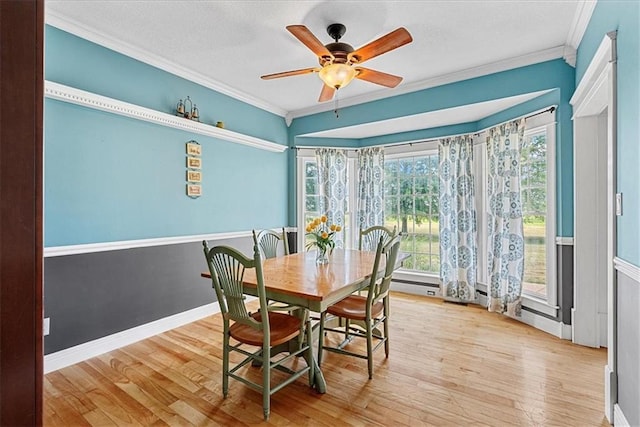 1148 N 1st Rd, Baldwin City, KS 66006 - dining space featuring ornamental molding, wood finished floors, ceiling fan, and a textured ceiling