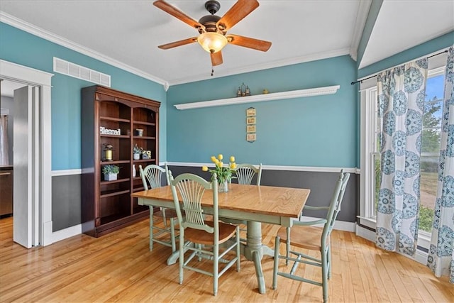 1148 N 1st Rd, Baldwin City, KS 66006 - dining room featuring hardwood / wood-style floors, crown molding, and ceiling fan