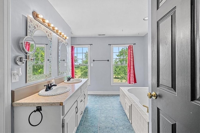 1148 N 1st Rd, Baldwin City, KS 66006 - full bath featuring double vanity, a bath, and tile patterned flooring