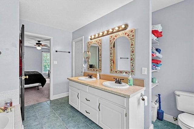 1148 N 1st Rd, Baldwin City, KS 66006 - ensuite bathroom with double vanity, a ceiling fan, a bath, and tile patterned flooring