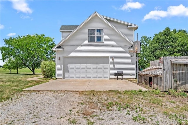 1148 N 1st Rd, Baldwin City, KS 66006 - view of property exterior with an attached garage