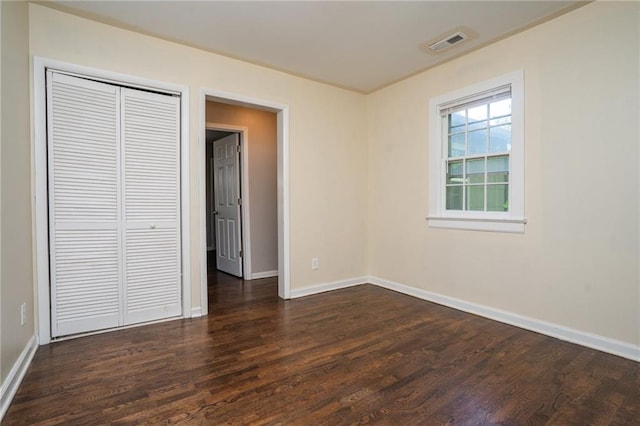 914 Jersey St, Baldwin City, KS 66006 - unfurnished bedroom featuring dark wood-style flooring and a closet