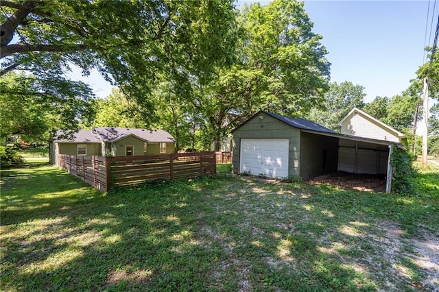914 Jersey St, Baldwin City, KS 66006 - view of yard with a garage and an outbuilding