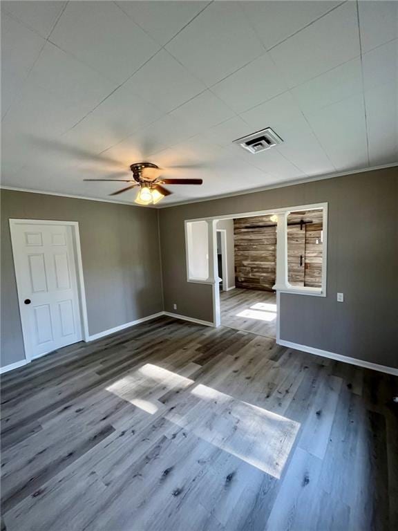 1629 E Oak St, Fort Scott, KS 66701 - unfurnished room with ceiling fan and wood finished floors
