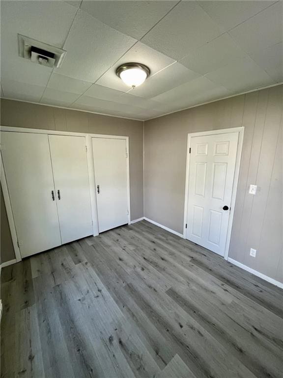 1629 E Oak St, Fort Scott, KS 66701 - unfurnished bedroom with wood finished floors and a closet