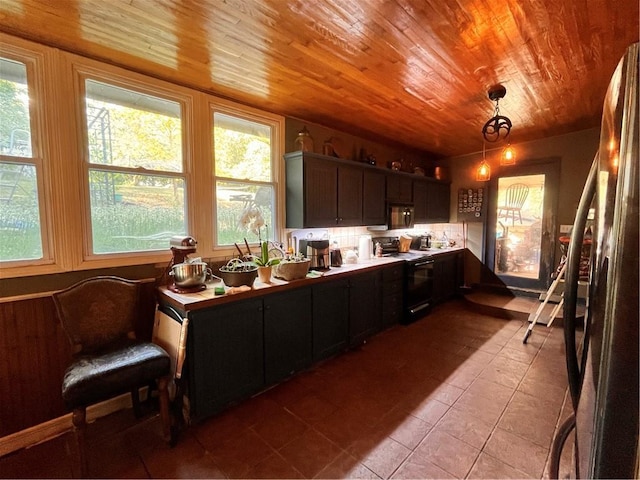 22 U Lake Shore Dr, Lake Lotawana, MO 64086 - kitchen with black electric range oven, tile patterned flooring, wooden ceiling, and plenty of natural light