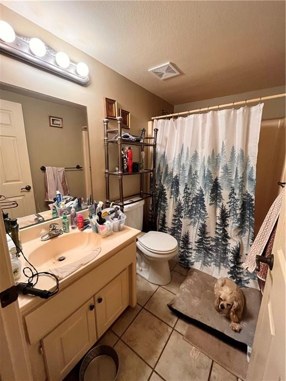 22 U Lake Shore Dr, Lake Lotawana, MO 64086 - full bath with tile patterned floors, vanity, a textured ceiling, and a shower with shower curtain