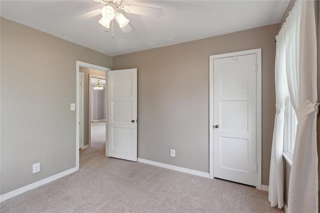 609 W Beech St, Independence, KS 67301 - unfurnished bedroom with carpet floors and ceiling fan